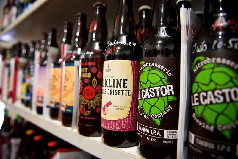 Beer bottles displayed on store shelf