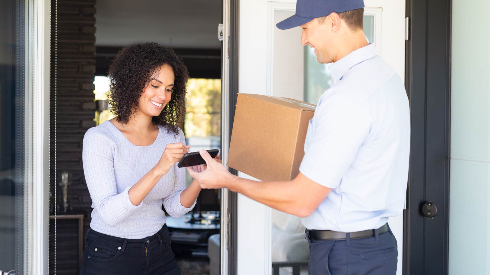 Wine delivery, woman signing for package